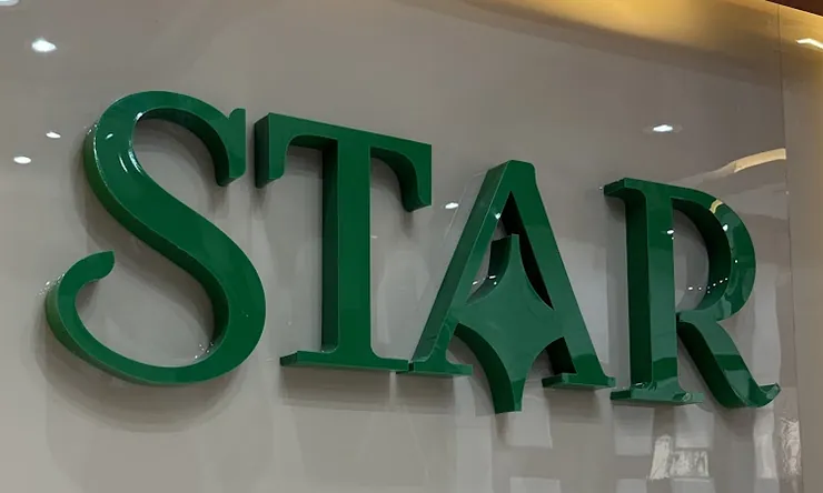 Green STAR letters mounted on the showroom wall